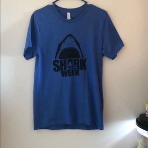 A blue shark week t-shirt